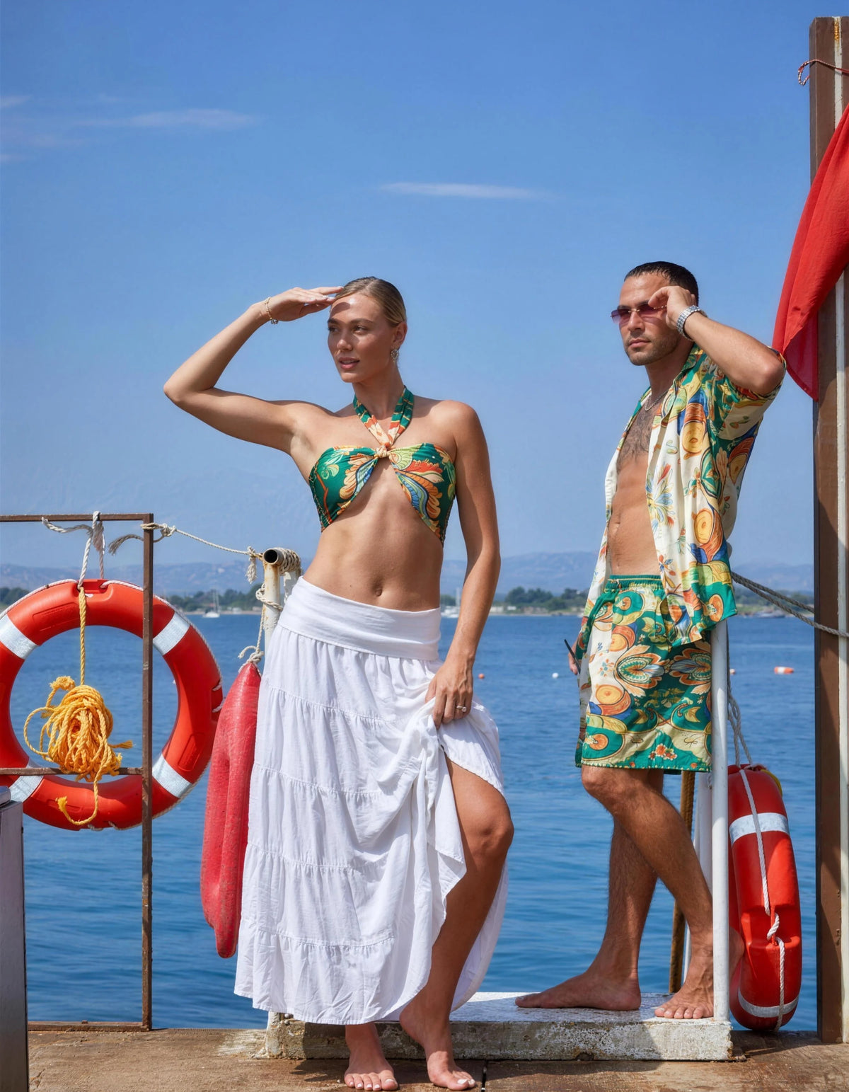 Dolce Vita his and hers styling on the pier, second look, men's satin shirt and swim shorts with the women's set, We Hustle