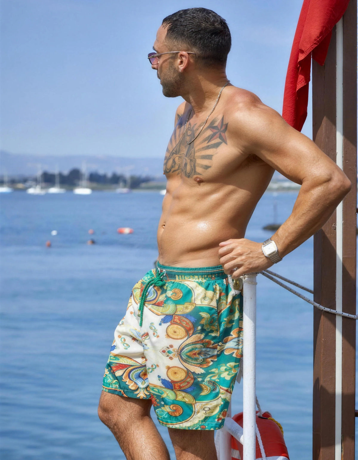 Dolce Vita matching printed swim shorts worn on the seafront, front view, We Hustle