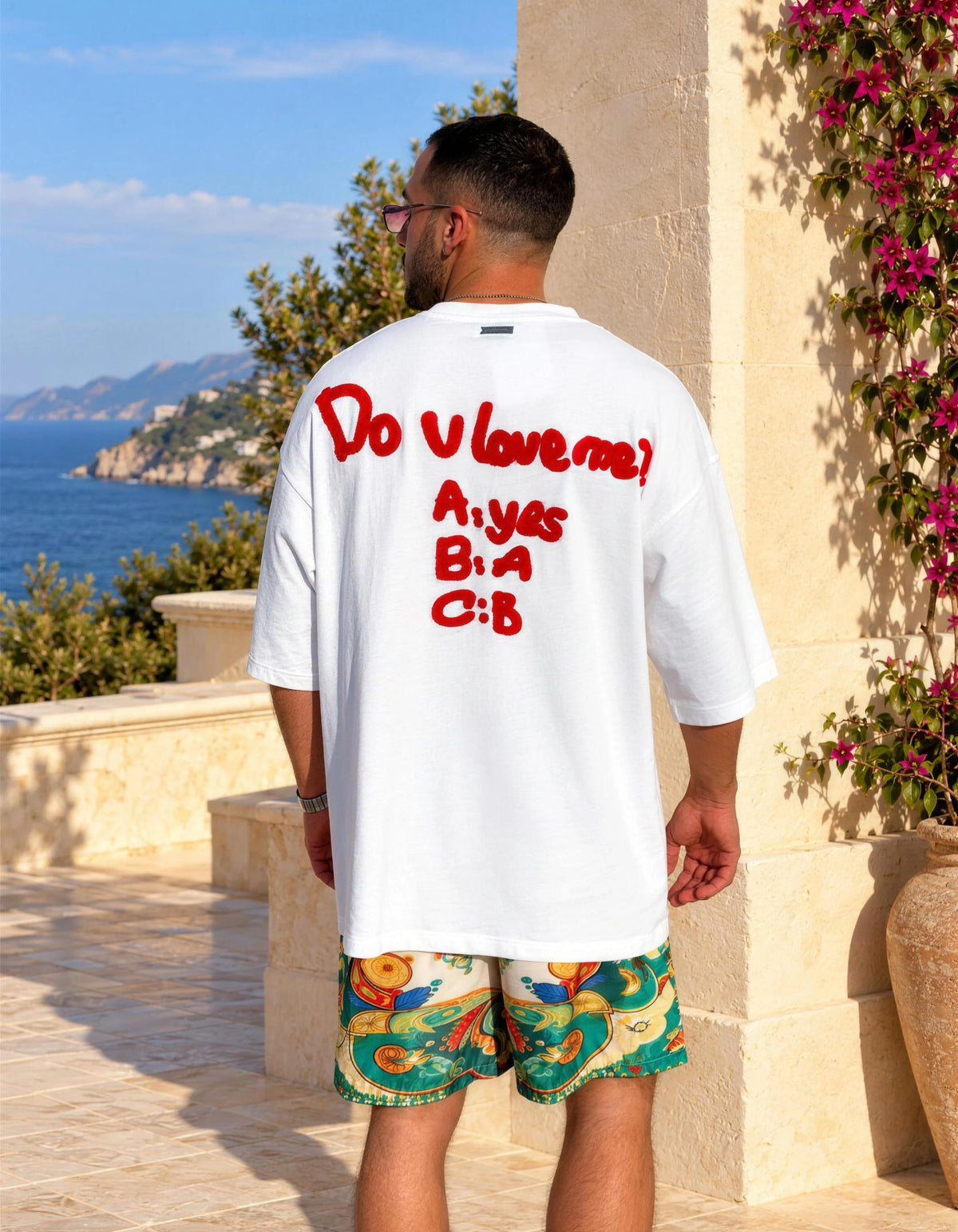 Dolce Vita men's printed swim shorts styled with the white Do U Love Me tee, back print view, We Hustle