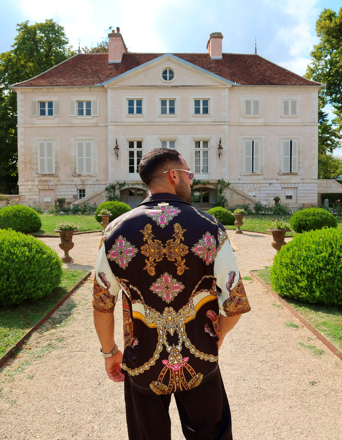 Monaco men's satin shirt, back view of the print in front of a chateau, We Hustle