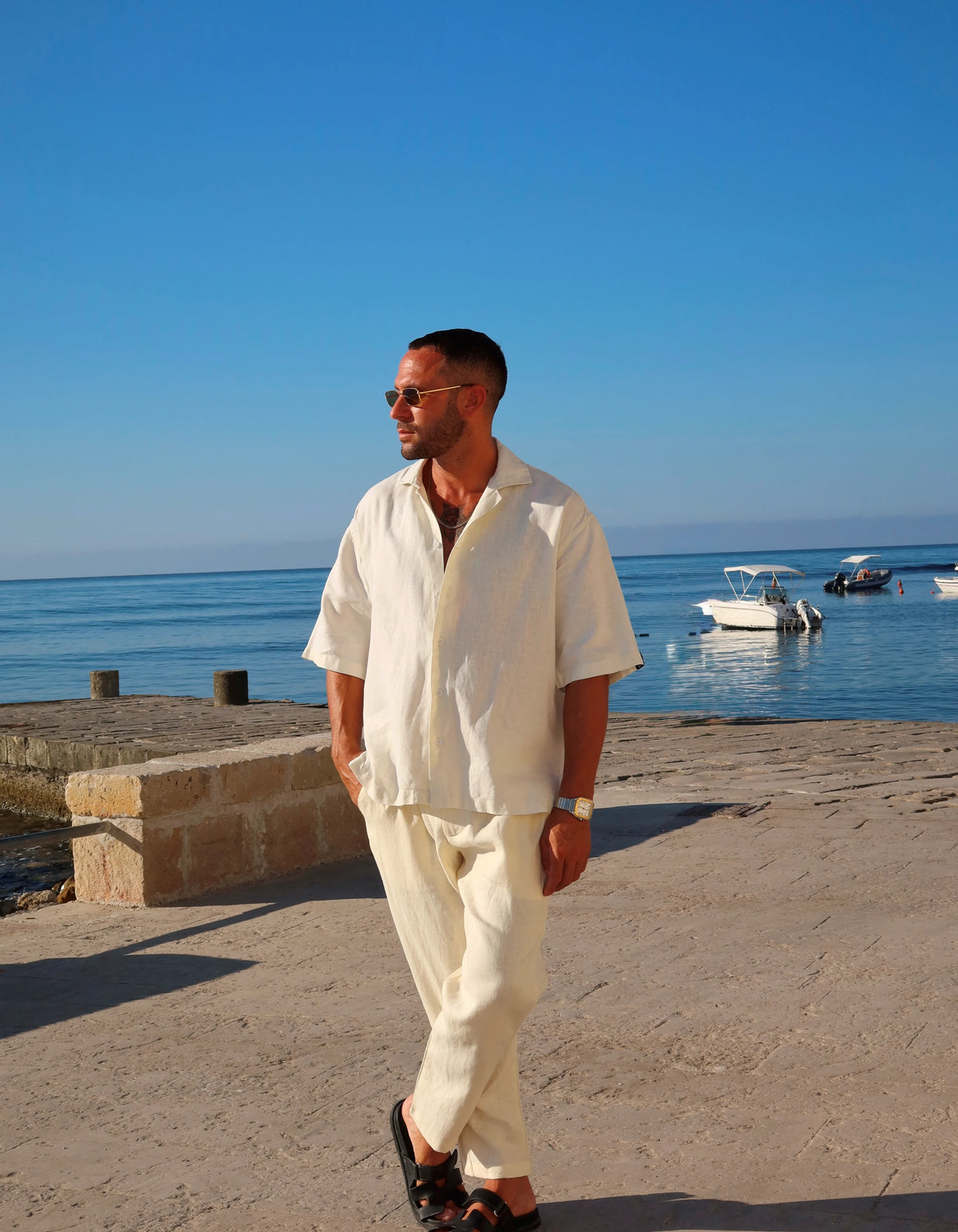 Off White men's linen set walking on the seafront, We Hustle